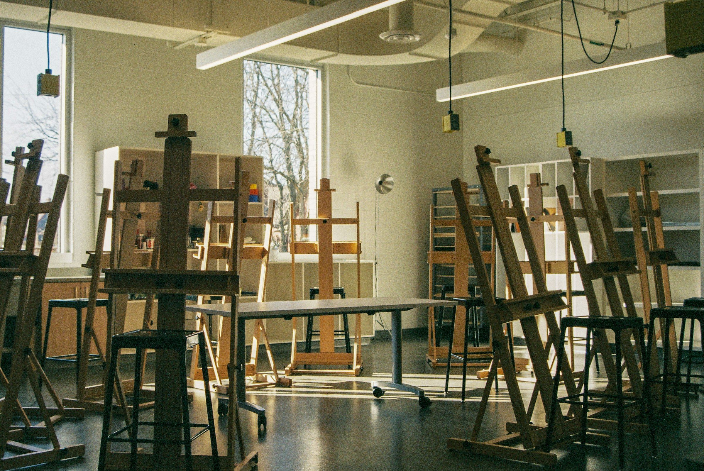 Empty painting studio with easels in morning light
